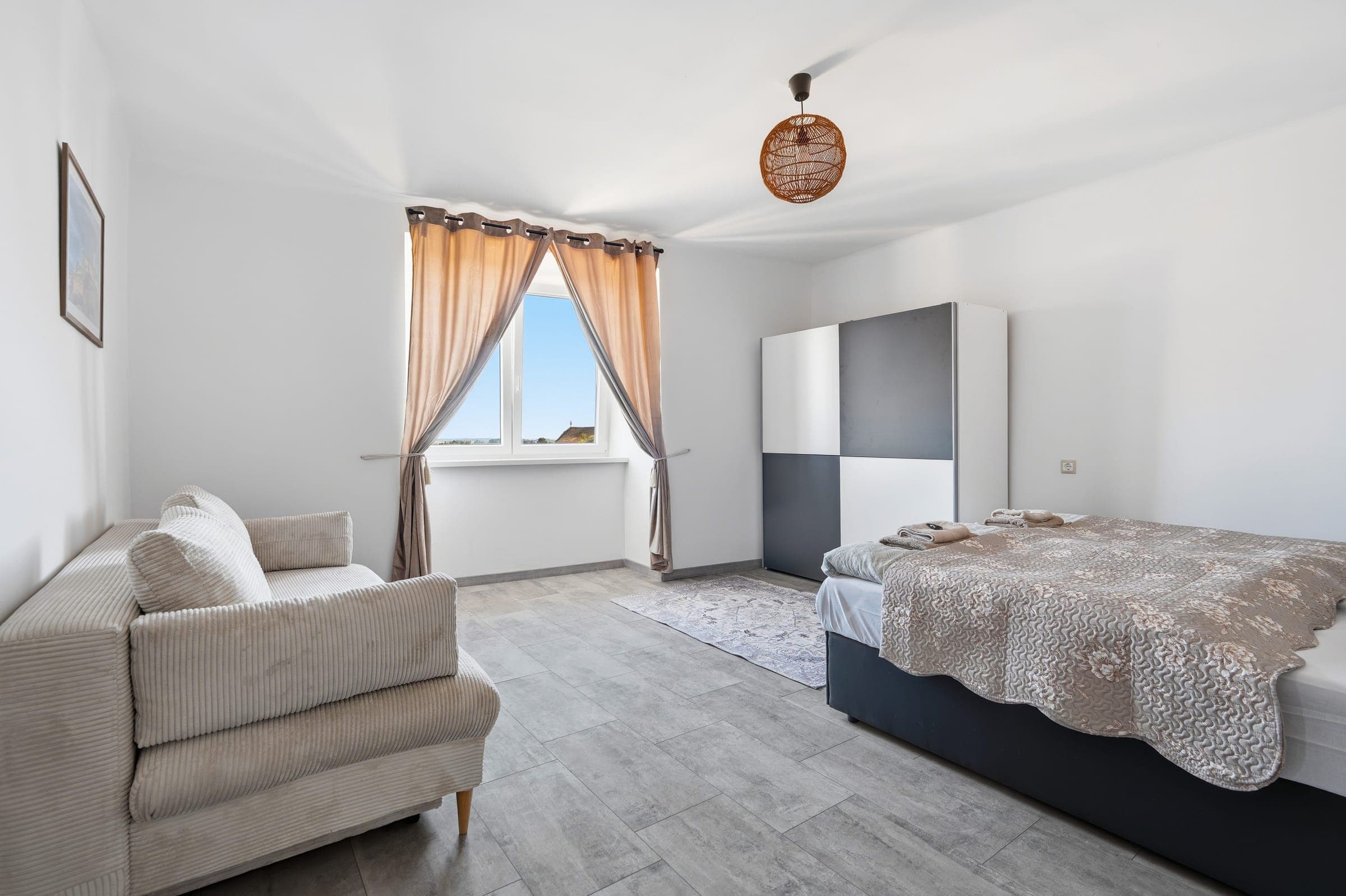 Living area with bed and wardrobe