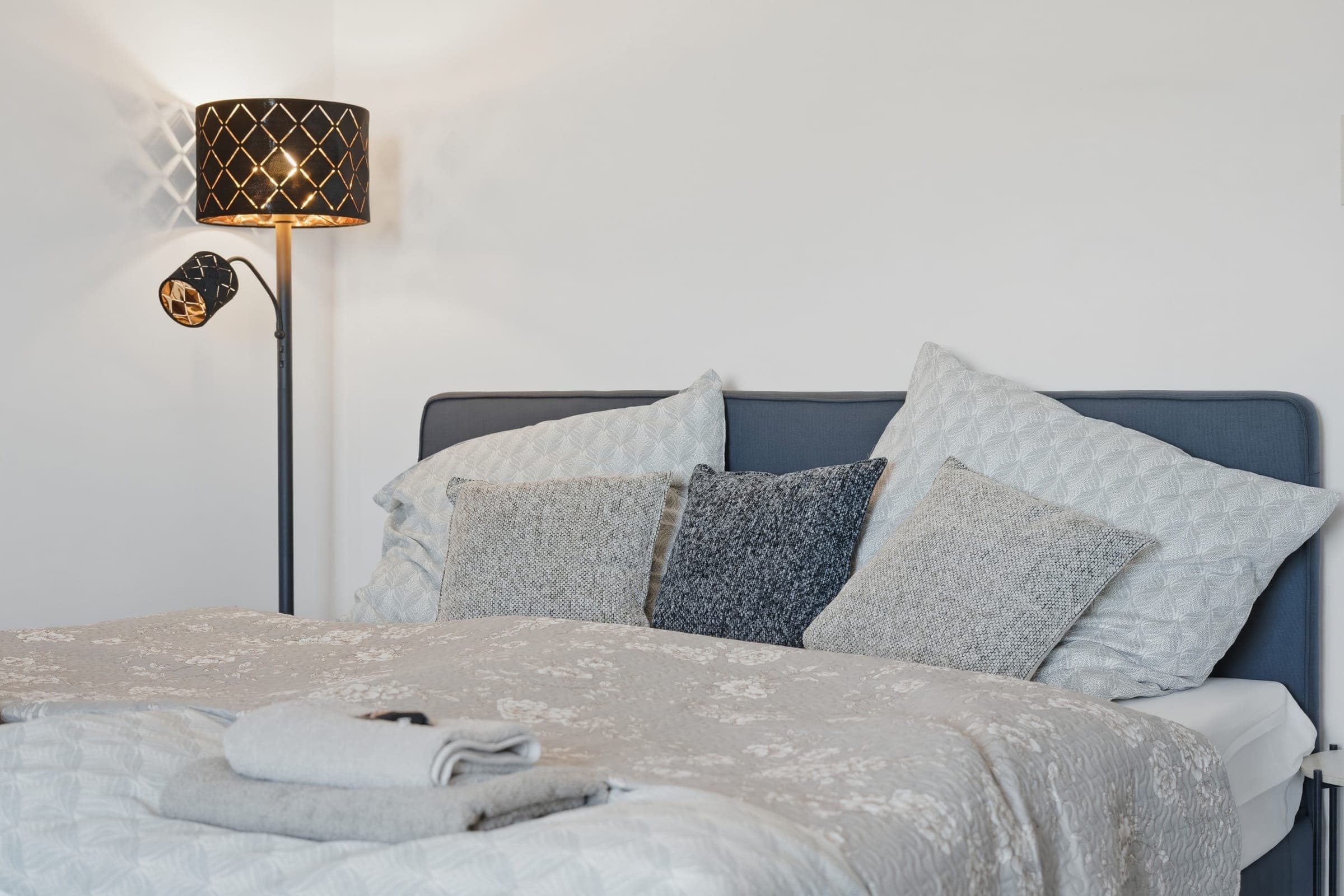 Double bed with upholstered headboard
