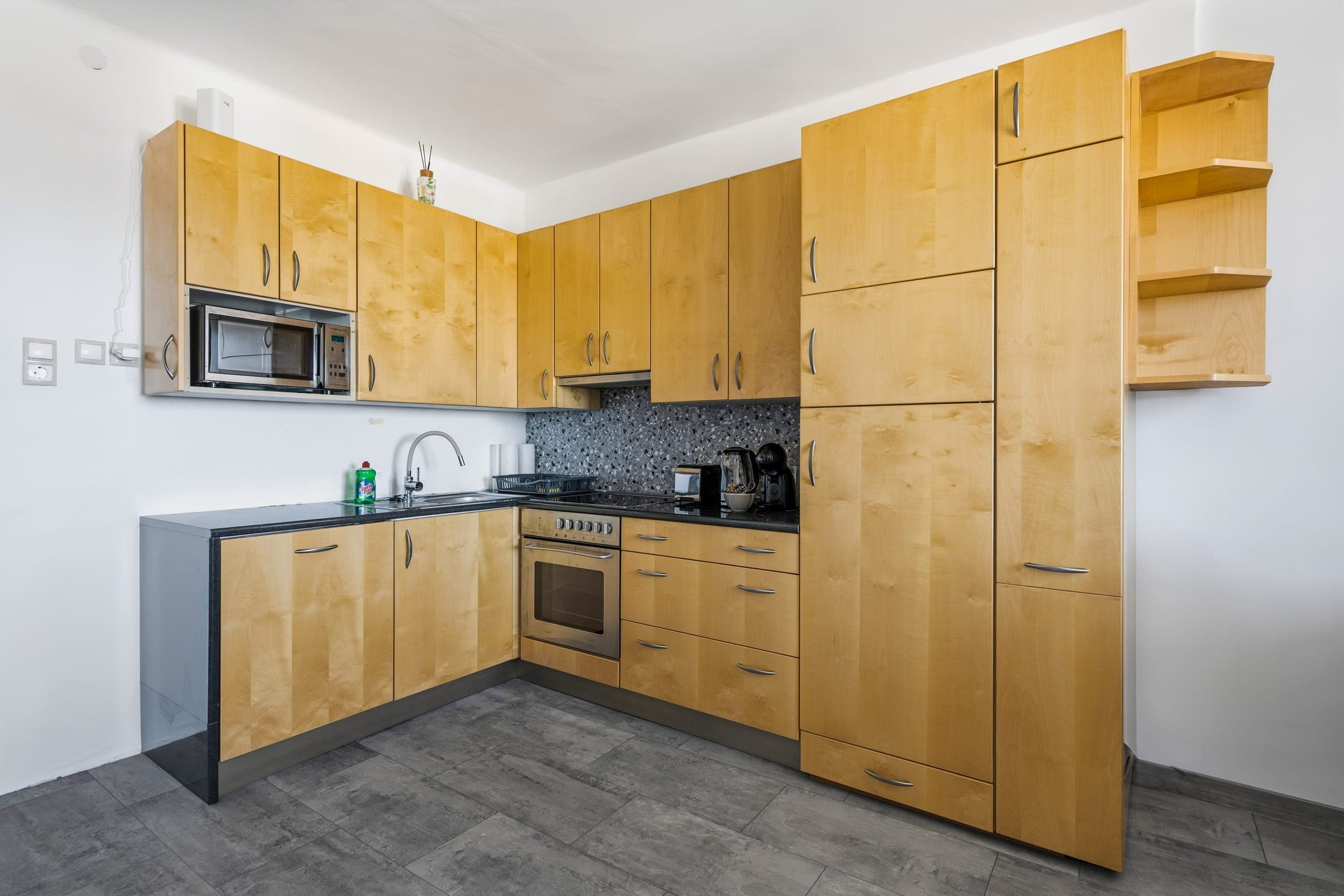 Fully equipped kitchen with oven and microwave